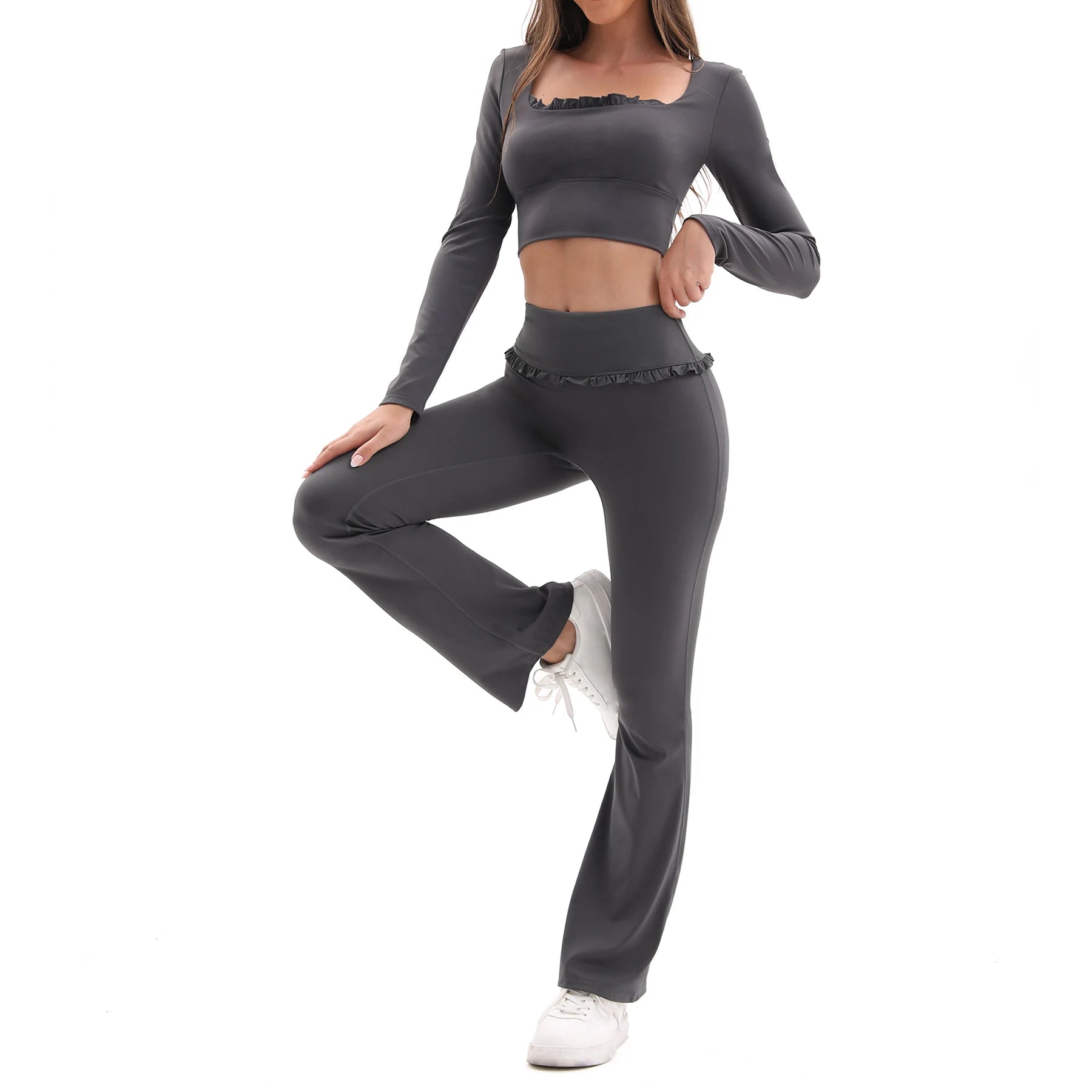 Person wearing a gray athletic outfit on a white background